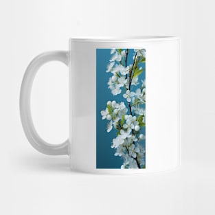 Soft white flowers against aquamarine sky sets a peaceful and romantic mood Mug